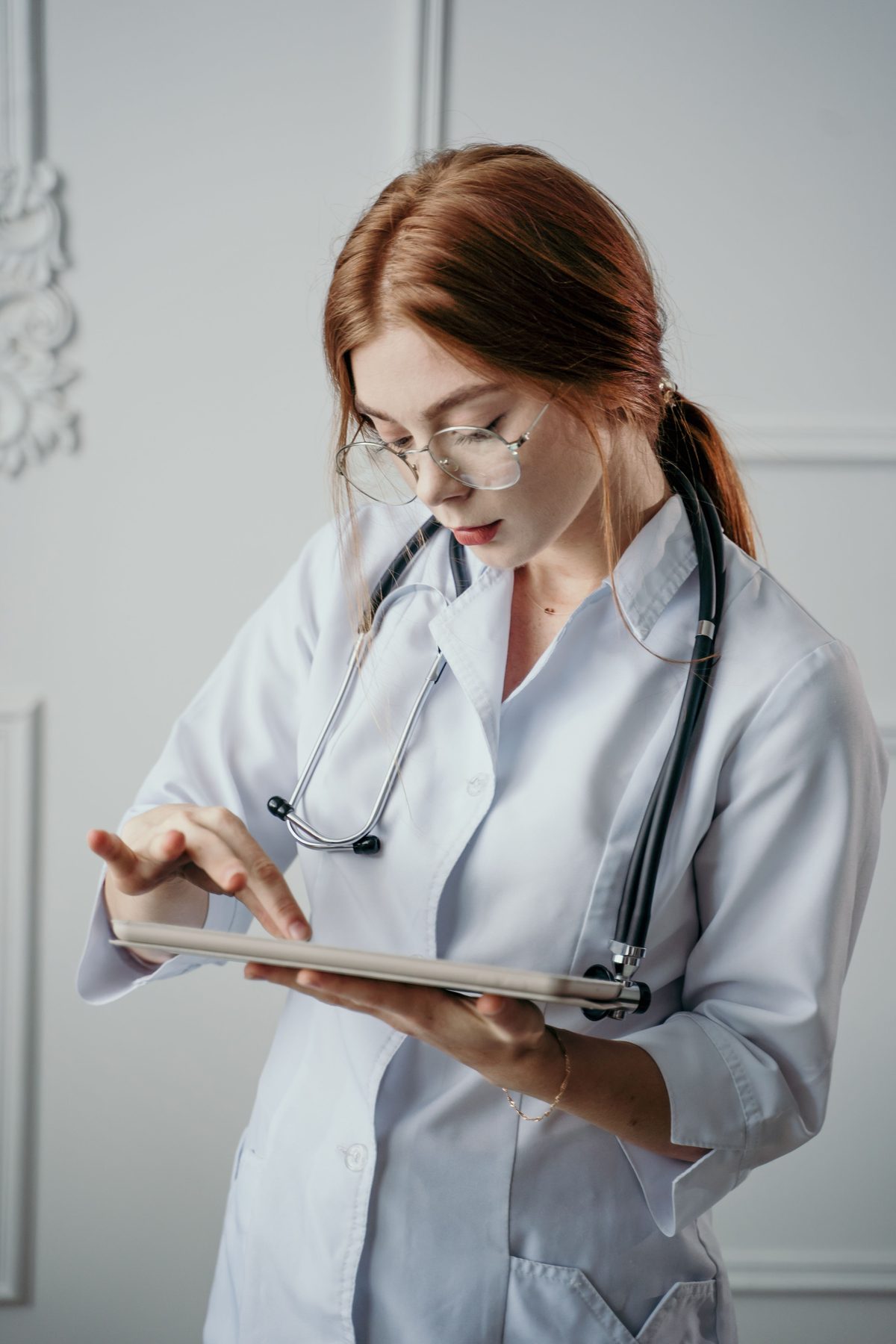 Healthcare professional using a tablet